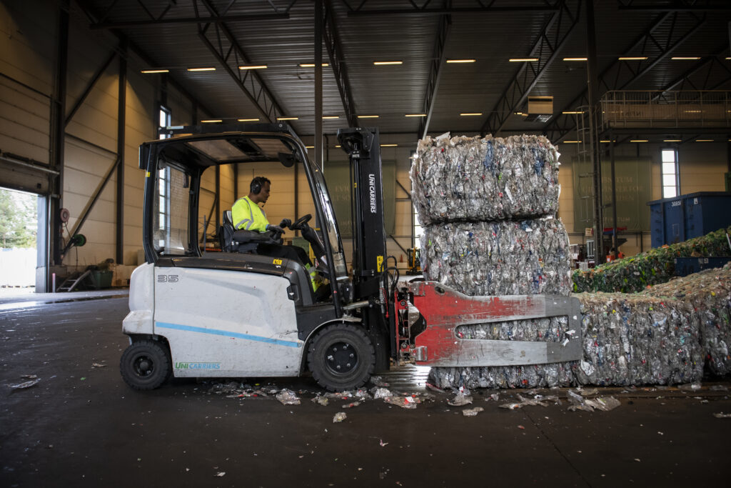 Bales of compressed beverage containers in Infinitum